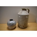 A large vintage stoneware flagon and a primitive glazed stoneware vase, AF.