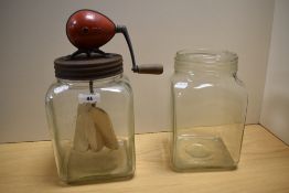 A 1930s Blow butter churn, another without the churn mechanism