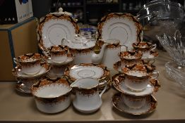 An early 20th century partial tea service, Diamond china Ltd, having russet toned border with