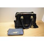 A BIBA purse in iridescent blue snakeskin effect fabric and a BIBA handbag in black leather and