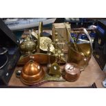 A variety of vintage brass and copper items, including; log basket, companion set, bellows, coal