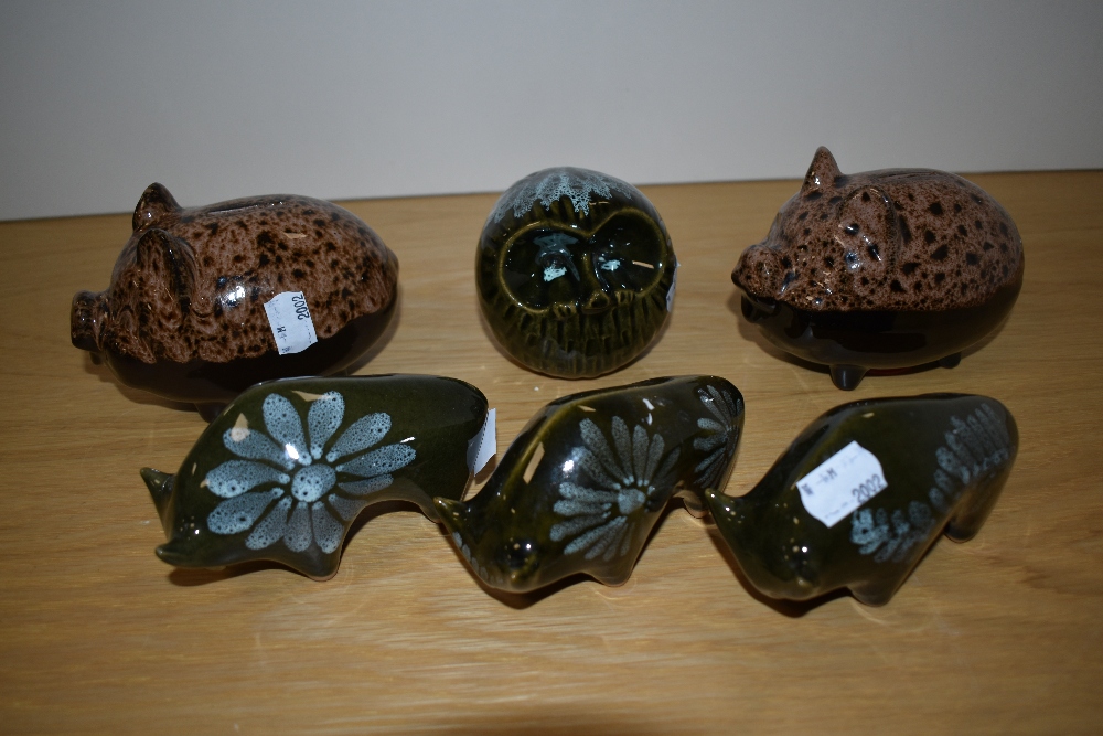 Two mid-late 20th Century glazed ceramic piggy banks, three Lotus pottery bull ornaments, and an