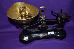 A set of vintage black painted Librasco kitchen scales with weights