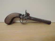 A 19th century Percussion Pistol, wooden grip, hexagonal barrel proof marks seen, slight damage to