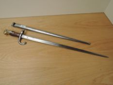 A French Gras Rifle Bayonet model 1874 with scabbard scabbard and blade marked 65838 blade length