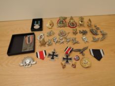A collection of mainly reproductions Badges and Medals including reproduction German Iron Crosses