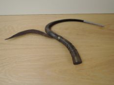 A possible African Ceremonial Sickle Knife having curved wood with metal blade