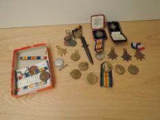 A collection of WWI Medals, loose in box comprising two War, nine Victory, one 1914 Star, three