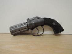 A 19th century Southall Pepperbox Percussion 6 Shot Pistol, chequered grip, proof marks on barrel,