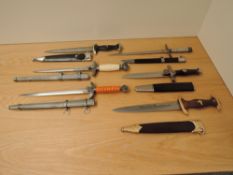A collection of six German reproduction WWII Military Daggers including SA, Luftwaffe etc all with