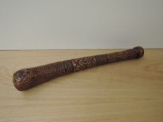 A possible South Sea/Pacific highly decorated carved wooden Club, length 40cm