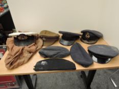 A collection of British Military Caps including Kings Own Side Cap, RAF Berets x2, RAF Peaked Caps