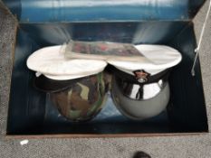 A Tin Trunk containing a Canvas Pistol Holster, Leather Pistol Holster, American Camouflage Steel