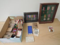 A box of WWII Medals including two framed Groups and a large number of War, Defence and Stars, in