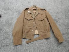 A WW2 period Battle Dress Blouse named B.Gyngell, marked WD military arrow 345, small size