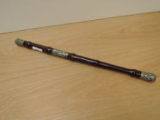 A Military Bamboo Swagger Stick having white metal decorated mounts, unscrews into two parts, length