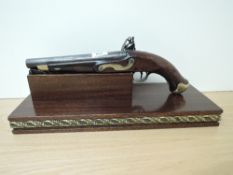 A 19th century or possible 18th century Naval Flintlock Pistol, swivel ram rod, brass butt, brass