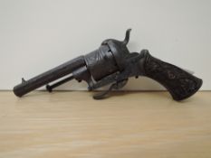 A 19th century Rim Fire 6 Shot Revolver, highly engraved, bakelite Grip with moulded decoration,