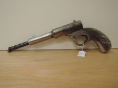 A Dolla Cub Air Pistol, spring loading, chromed barrel, chequered grip (af), overall length 26cm,