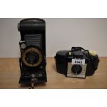A Kodak Six-20 folding camera and Kodak Brownie 127 camera