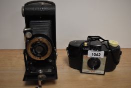 A Kodak Six-20 folding camera and Kodak Brownie 127 camera