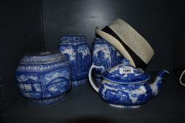 Three Rington's ltd tea caddies, one having no lid, a Malling blue and white tea pot