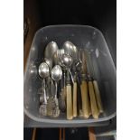 A small collection of flatware including fish knives and forks along with spoons