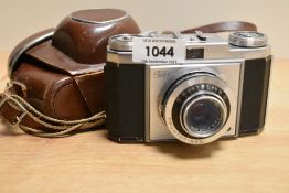 A Zeiss Ikon camera with 1:3,5 f45mm lens in leather cover and Yashica light meter