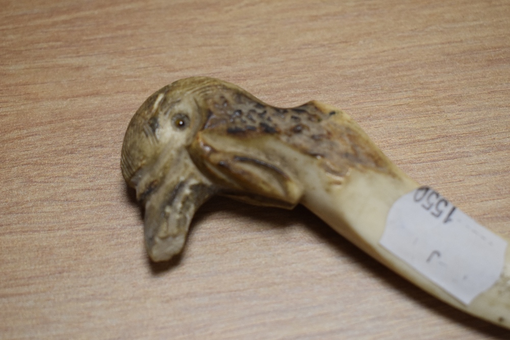 An antique horn letter opener, having carved bird handle, AF. - Image 2 of 2