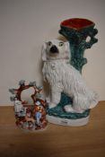 A 19th Century Staffordshire pottery spaniel vase, 35cm tall, and another figural ornament of same