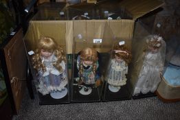 Eleven assorted porcelain dolls.