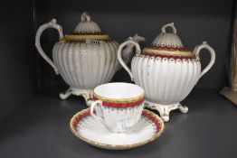 A Victorian porcelain three piece part tea service, to comprise a twin handled lidded pot, a teapot,