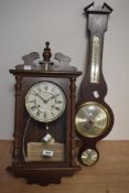 A reproduction wall clock and a mid century barometer.