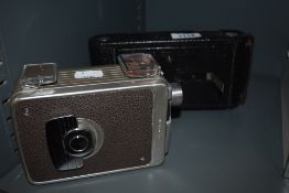 A Kodak Brownie 8mm movie camera and a Kodak No 1A Jr.