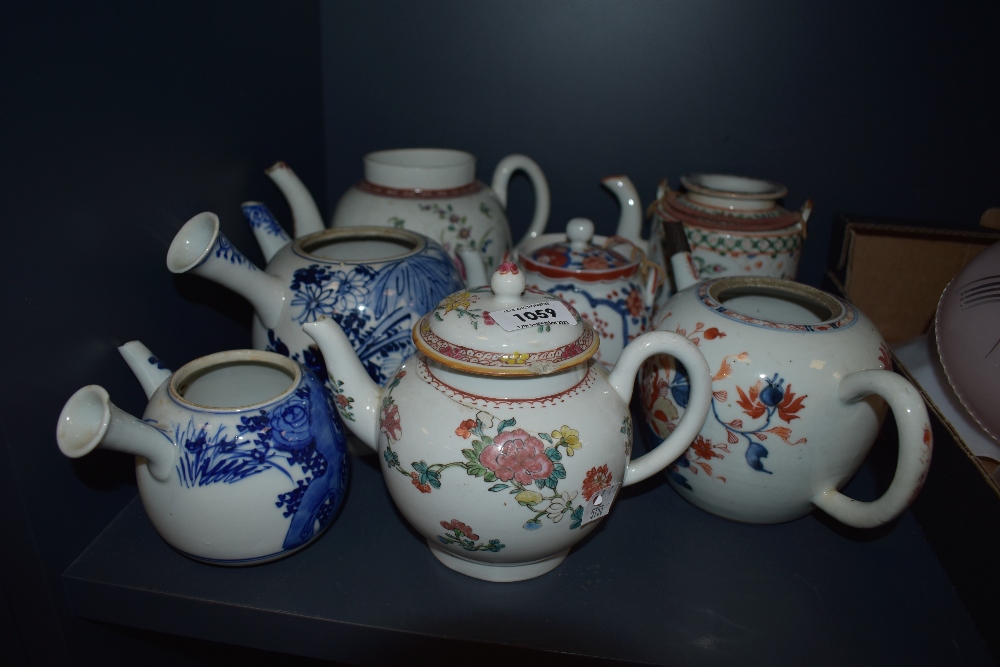 Seven antique teapots, including 18th century porcelain, two Japanese examples and similar.