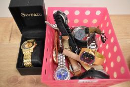 A small collection of designer style wristwatches, a Serrato gold coloured wristwatch, and others by
