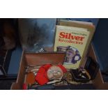 A small selection of books including Britain's Wonderful Air Force, a small metal box and a