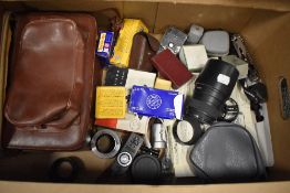 A box of various camera and photographic items including Sigma zoom 55-200mm 1:4-5,6 DC lens,