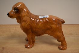 A cocker spaniel study in brown gloss finish.