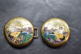 An Oriental Satsuma porcelain two piece belt buckle, each circular piece with enamel and gilt scenic