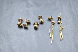 Three pairs of 9ct gold earrings for pierced ears including knot and chain drops, total approx 2g