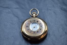 A 9ct rose gold half hunter top wound pocket watch by Kendal & Dent, London watch makers to the