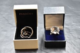 Three Scandinavian silver rings including rock crystal by Karl Laine, Norwegian double loop ring,
