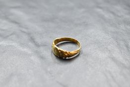 A Victorian yellow metal band ring having diamond chip and moulded decoration, no marks, size M &