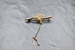 A 15ct gold bar brooch having a central open heart with seed pearl decoration, approx 2.9g
