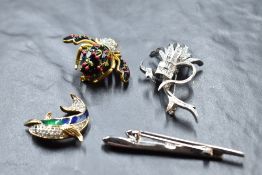 Three Attwood & Sawyer brooches including dolphin and a Joan Rivers cherry bee brooch