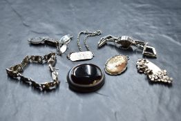 A selection of silver and white metal jewellery including bull's eye agate brooch, cameo brooch,