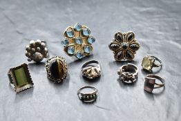 Ten silver and white metal rings of various forms, including modernist, Tiger's Eye, turquoise,