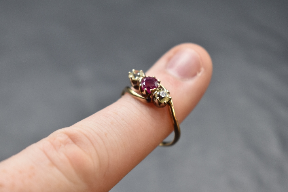 A ruby and diamond trio ring having central ruby, approx 0.5ct, two diamonds each approx 0.25ct in - Image 3 of 3