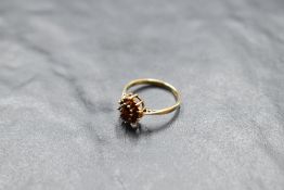 A garnet cluster ring on a 9ct gold loop, size J & approx 1.5g